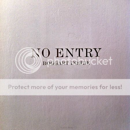 On a cupboard door: No Entry - Boggart Inside - The House of MinaLima