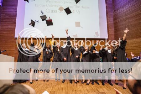 Class of 2014 1/2 graduates throw their caps at the end of the ceremony (Photography: Martijn van Dam) Class of 2014 1/2 graduates throw their caps at the end of the ceremony (Photography: Martijn van Dam)